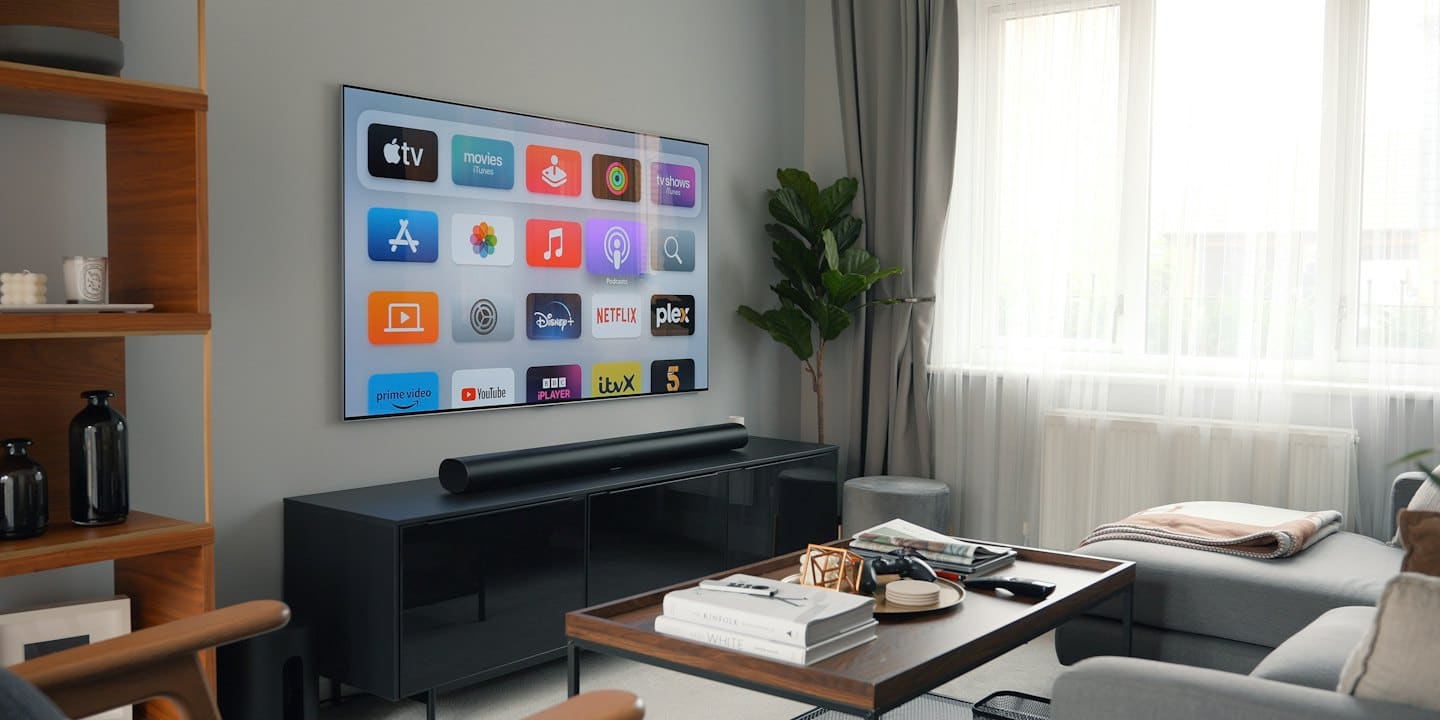 Modern living room with a smart TV above a media console.